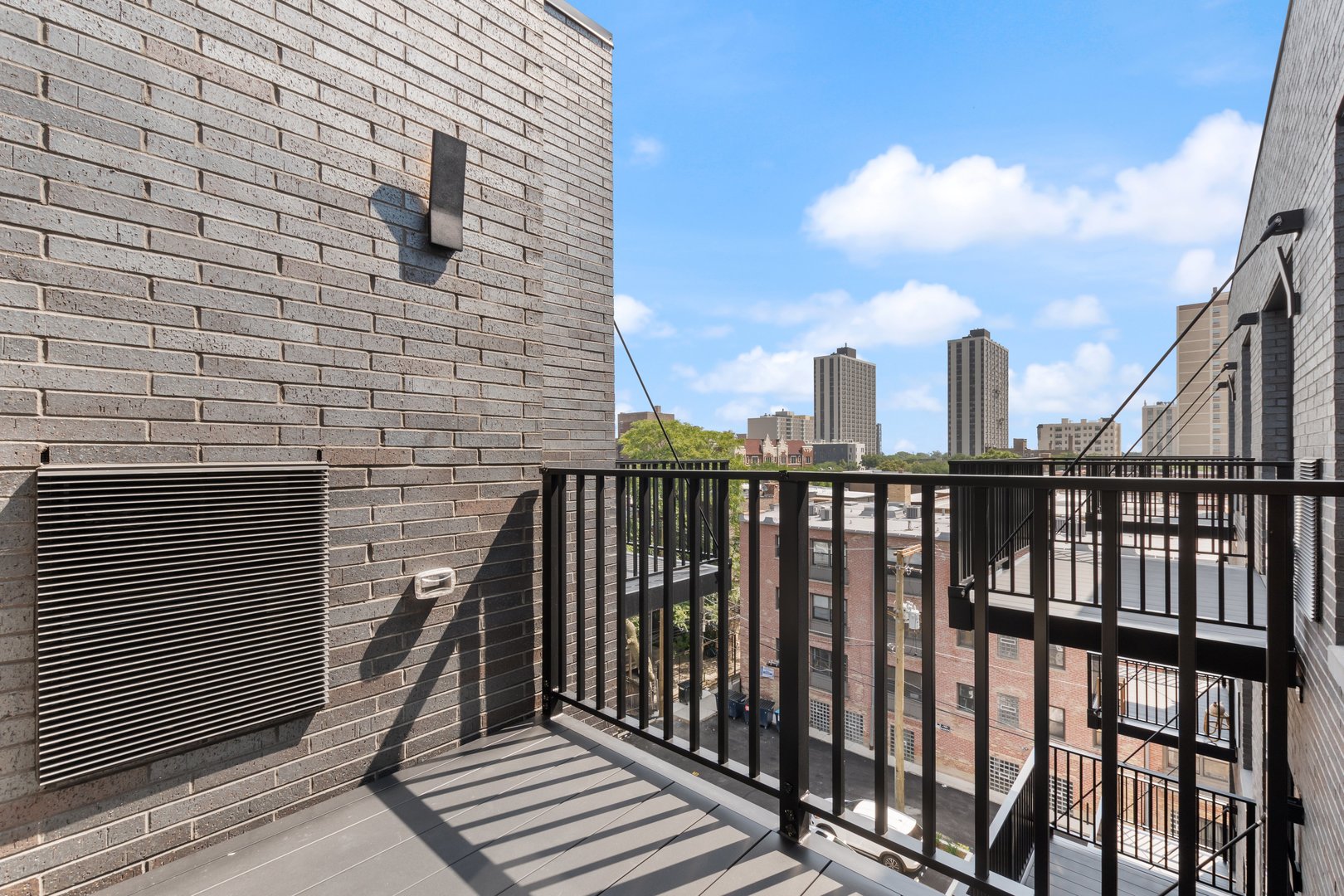 Undisclosed Address Chicago, IL 60640 - Photo 18 of 35 a view of a brick building from a balcony