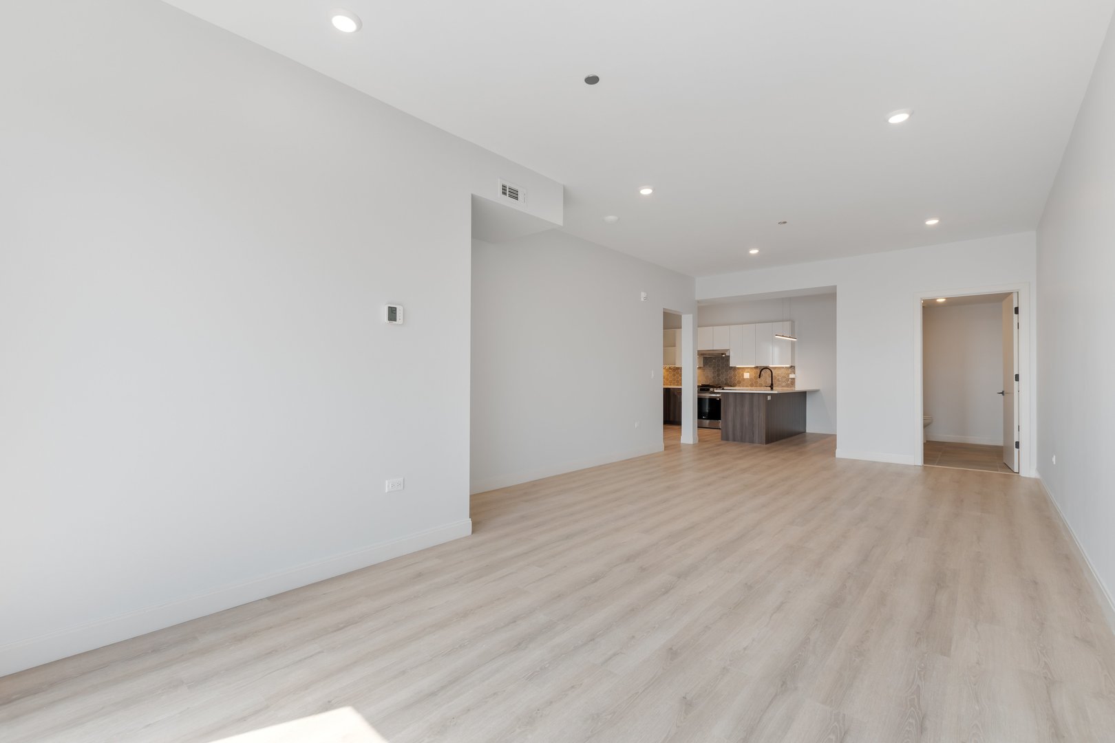 Undisclosed Address Chicago, IL 60640 - Photo 21 of 35 a view of empty room with a kitchen