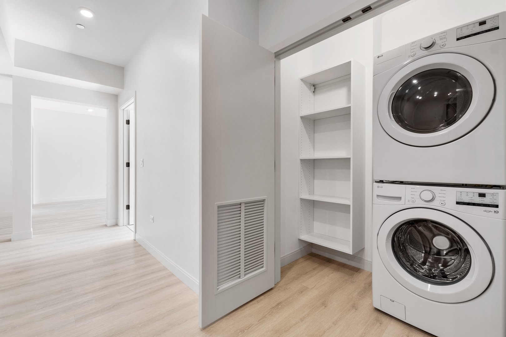 Undisclosed Address Chicago, IL 60640 - Photo 22 of 35 a view of a hallway with washer and dryer