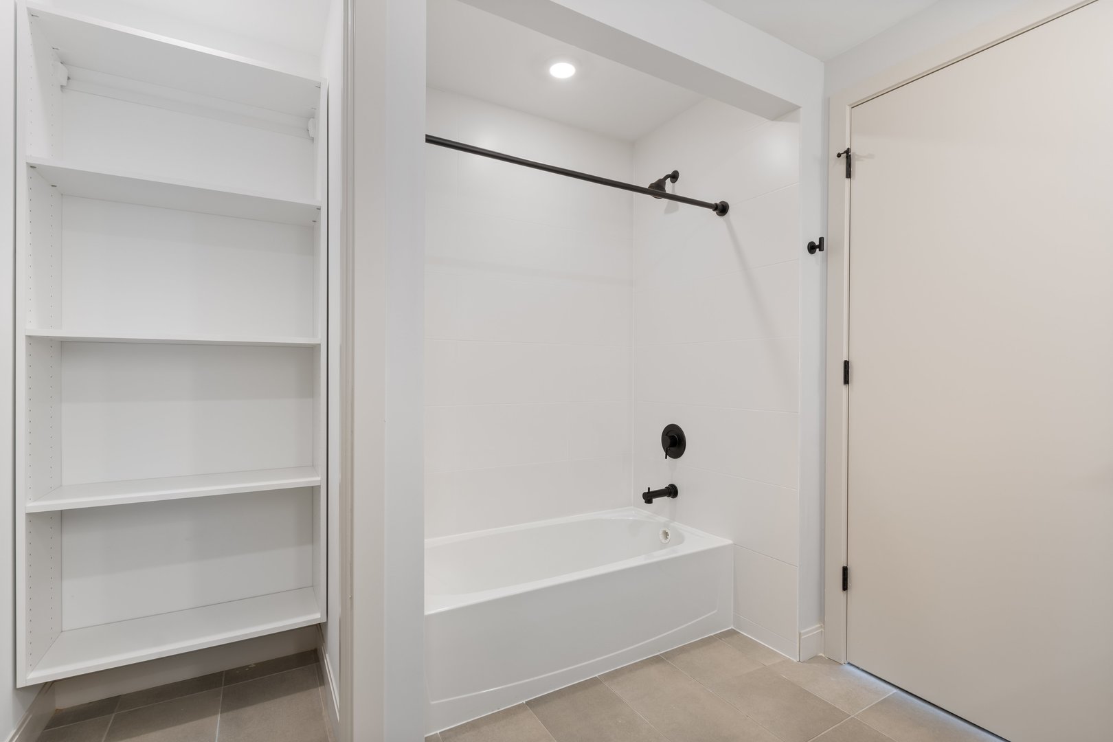 Undisclosed Address Chicago, IL 60640 - Photo 24 of 35 a bathroom with a bathtub and a shower