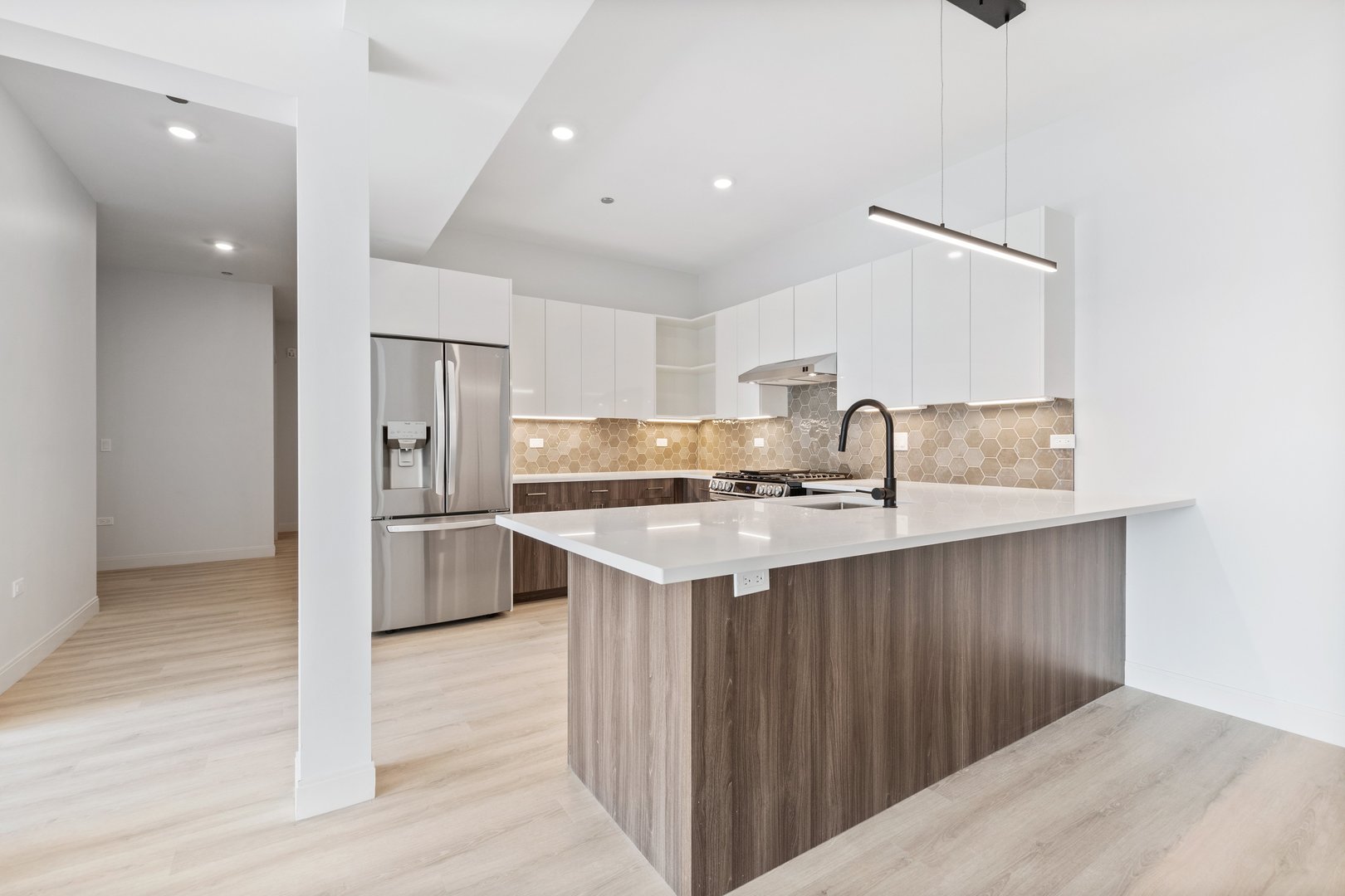Undisclosed Address Chicago, IL 60640 - Photo 4 of 35 a kitchen with a sink and refrigerator
