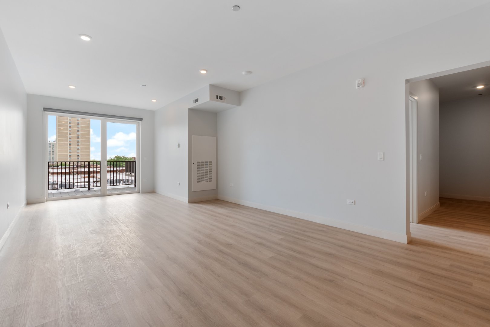 Undisclosed Address Chicago, IL 60640 - Photo 7 of 35 an empty room with wooden floor and windows