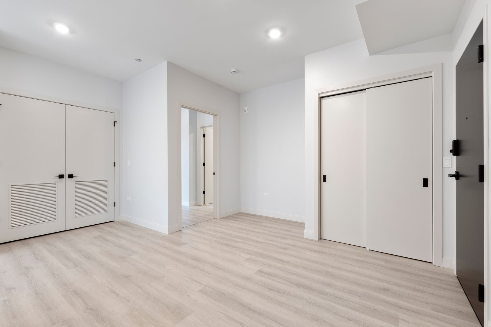 Undisclosed Address Chicago, IL 60640 - Photo 9 of 35 a view of an empty room with wooden floor