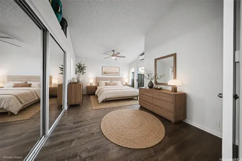 a bed room with furniture and a mirror
