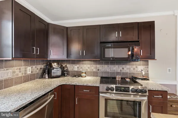 a bedroom with two beds and a large window