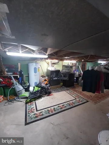 a front view of a house with a yard fountain and outdoor seating