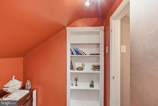 a view of a bedroom from a hallway