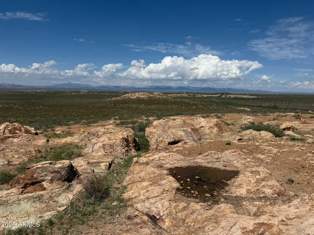 a view of a lake with sunset