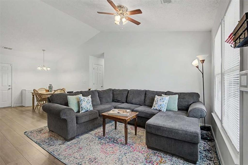 94 Villa Rosa Way Temple, GA 30179 - Photo 11 of 34 a living room with furniture and a rug