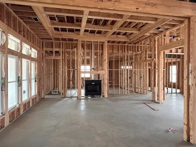 a view of an empty room with large windows