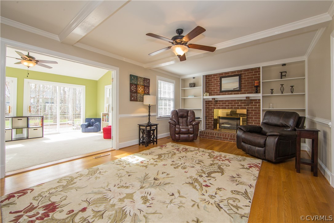 12721 Foxstone Road Midlothian, VA 23113 - Photo 8 of 49 a living room with furniture window and a fireplace