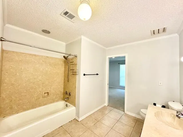 an empty room with closet and windows