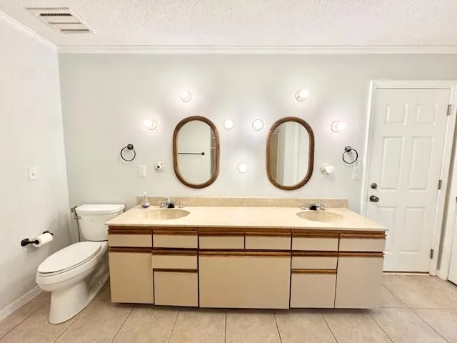 an empty room with closet and a bathroom