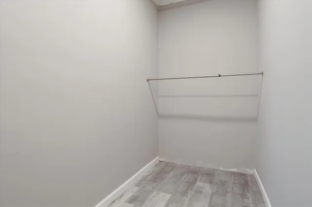 a view of an empty walk in closet
