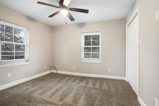 a view of empty room with windows