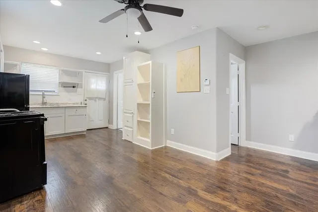 a view of a kitchen with a sink and a refrigerator