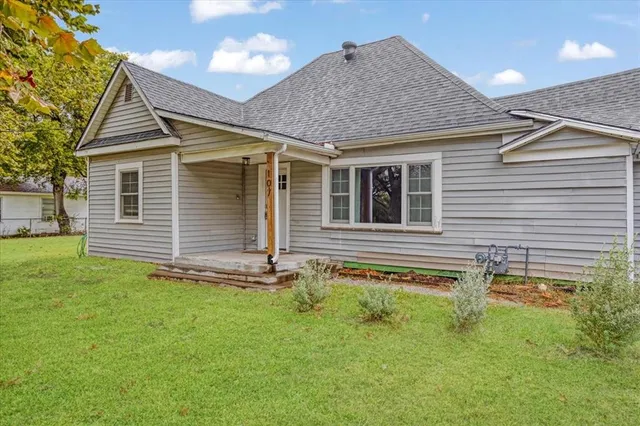 a backyard of a house with lots of green space