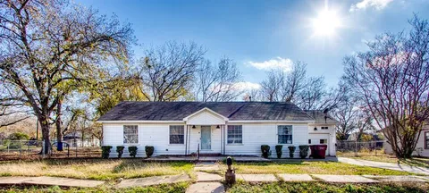 a view of a house with swimming pool and a yard