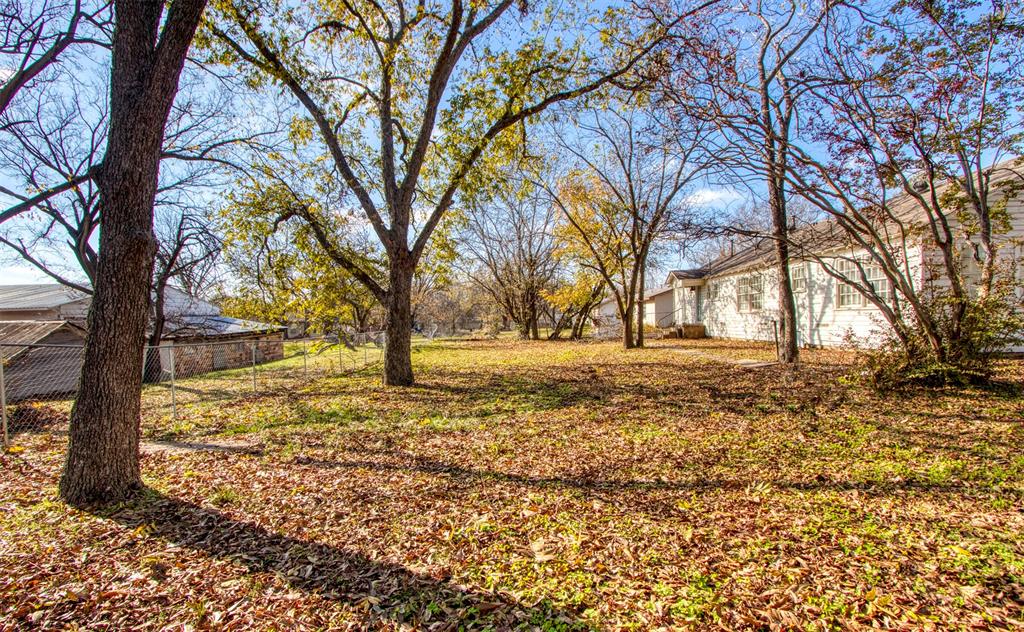 903 West 8th Street Bonham, TX 75418 - Photo 20 of 21 a view of large trees with yard