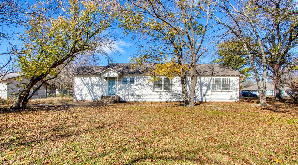 903 West 8th Street Bonham, TX 75418 - Photo 21 of 21 a view of a yard with a tree
