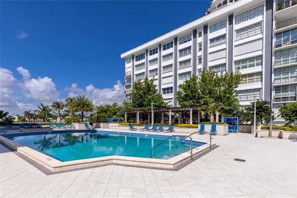 a view of a swimming pool with a lounge chairs