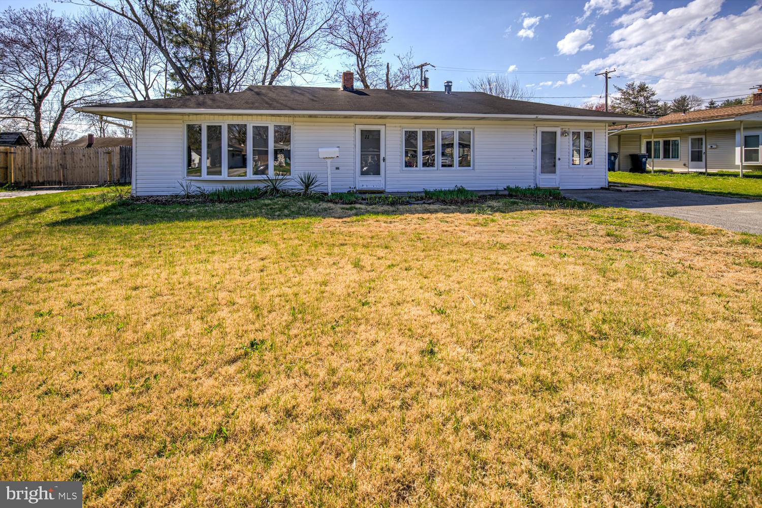 a view of a yard in front of a house