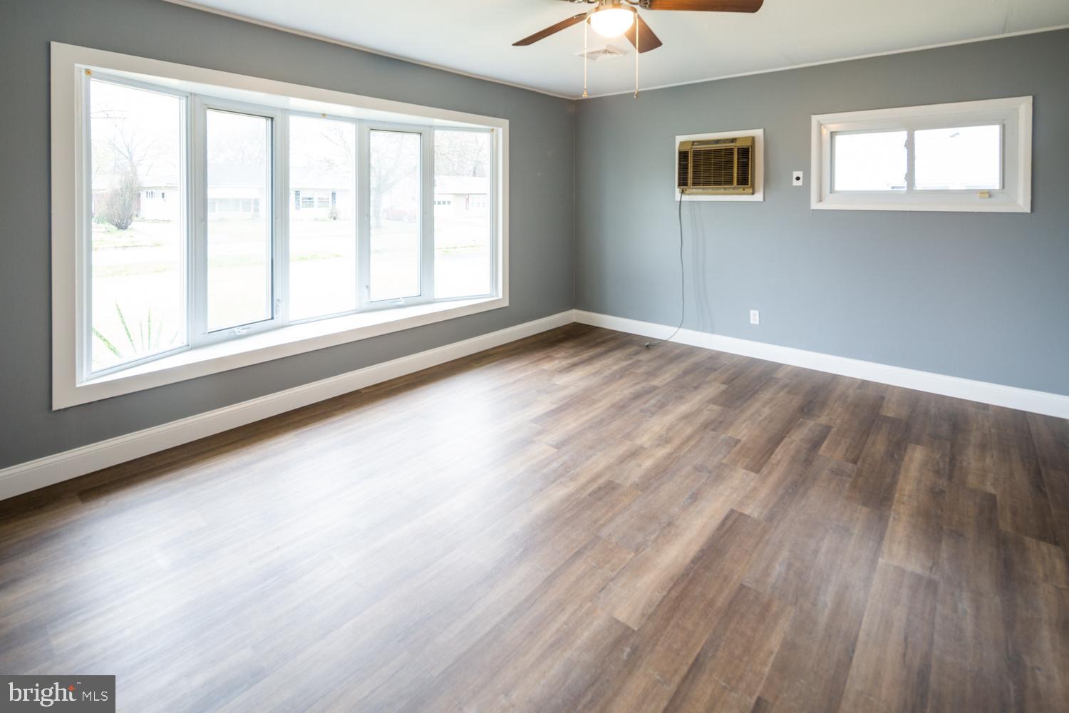 11 Carlisle Road Newark, DE 19713 - Photo 2 of 20 wooden floor in an empty room with a window