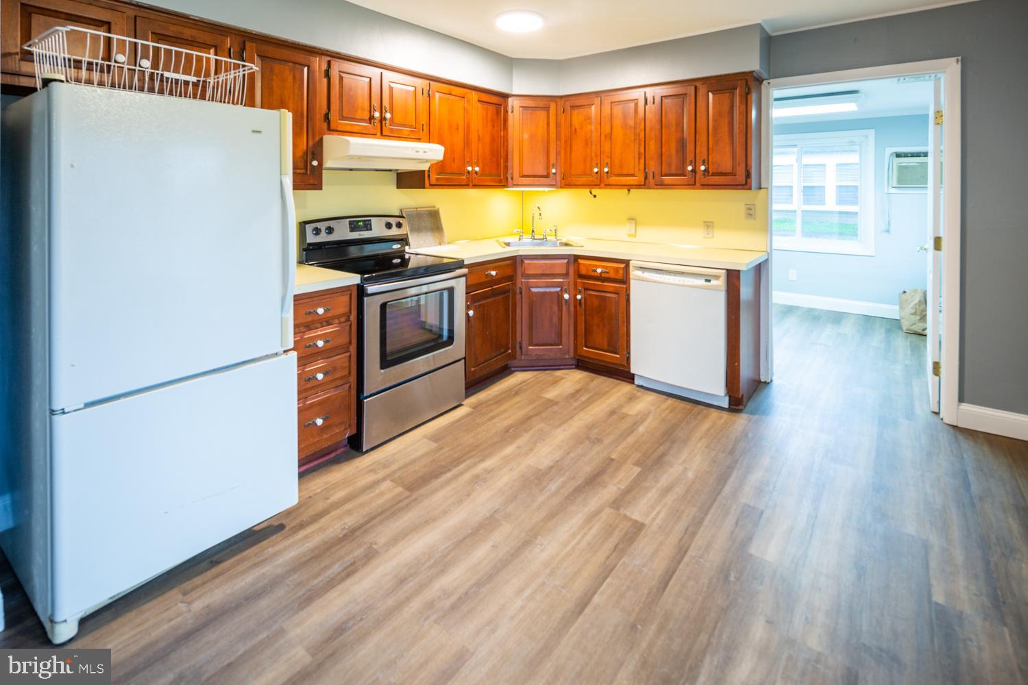 11 Carlisle Road Newark, DE 19713 - Photo 7 of 20 a kitchen with stainless steel appliances granite countertop a stove a sink dishwasher and a refrigerator