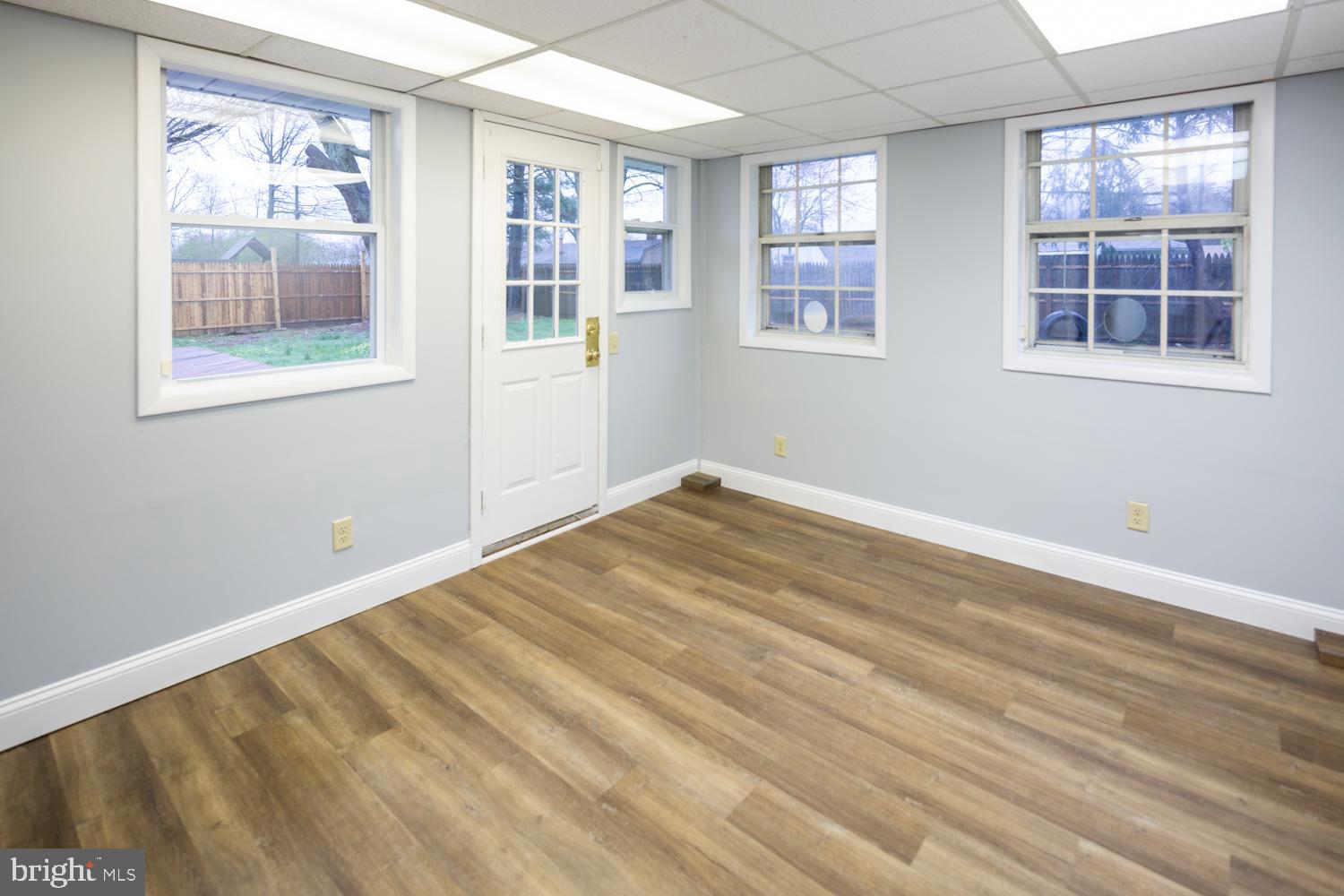 11 Carlisle Road Newark, DE 19713 - Photo 10 of 20 a view of empty room with wooden floor and fan