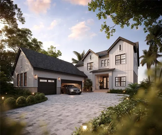 a front view of a house with a garden and parking