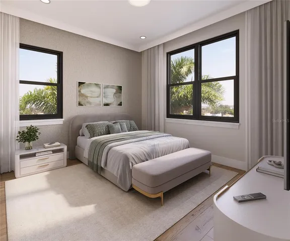a bedroom with a bed and a large window