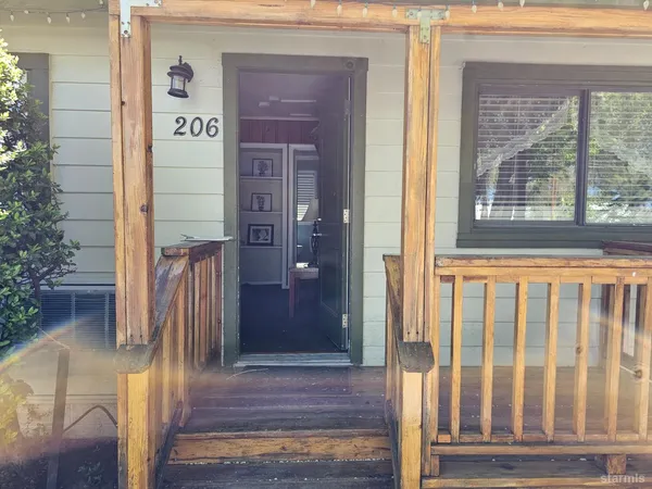 a front view of a house with a glass door