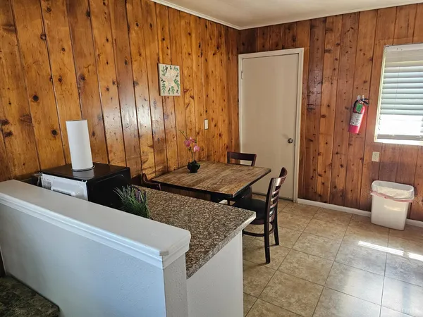 a kitchen with a refrigerator sink stove and cabinets