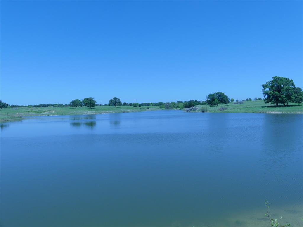 3421 Schoolhouse Road Forestburg, TX 76239 - Photo 1 of 39 a view of a lake with houses in the background