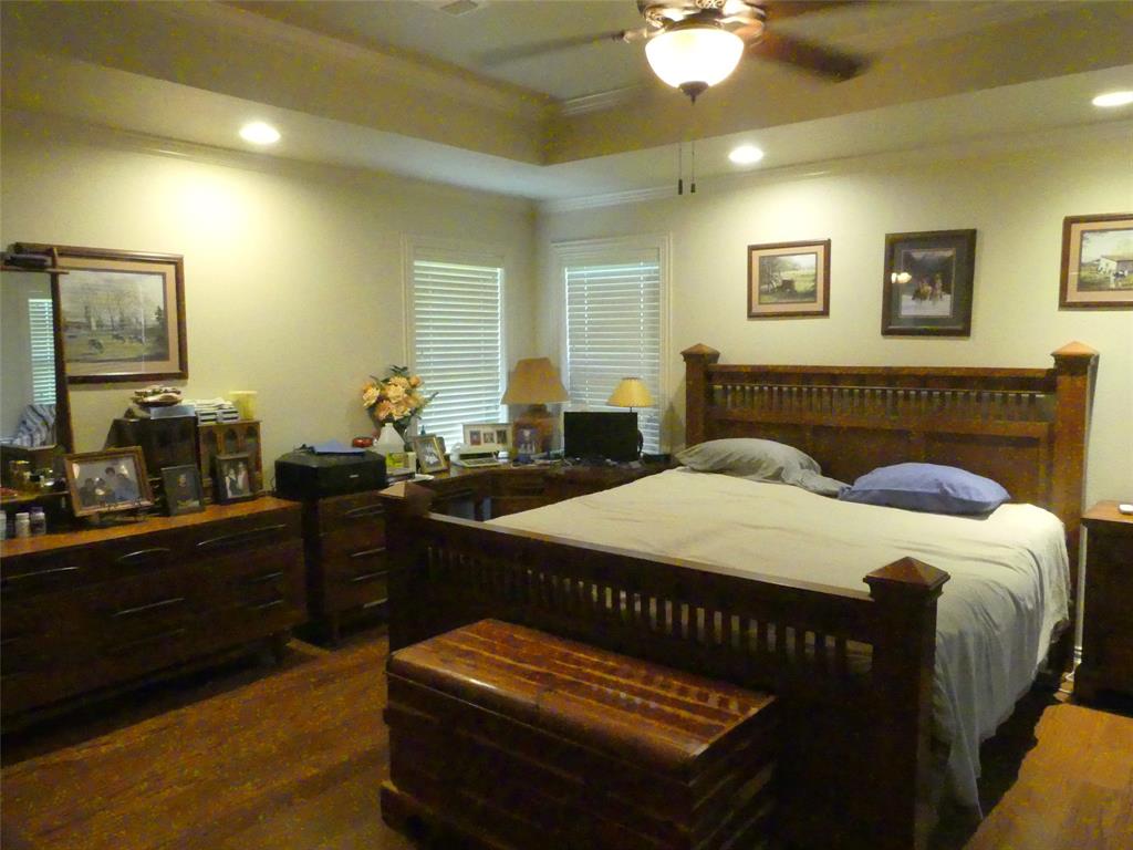 3421 Schoolhouse Road Forestburg, TX 76239 - Photo 14 of 39 a bedroom with a bed and a dresser
