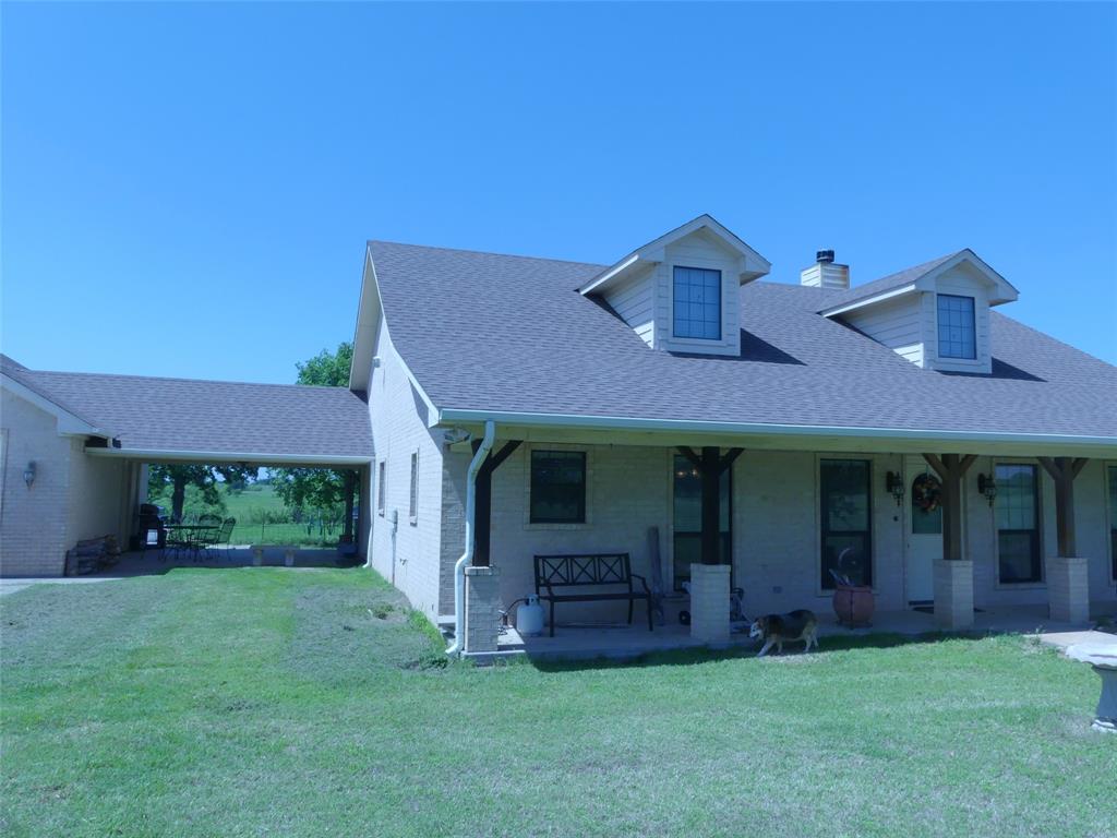 3421 Schoolhouse Road Forestburg, TX 76239 - Photo 2 of 39 front view of a house with a yard