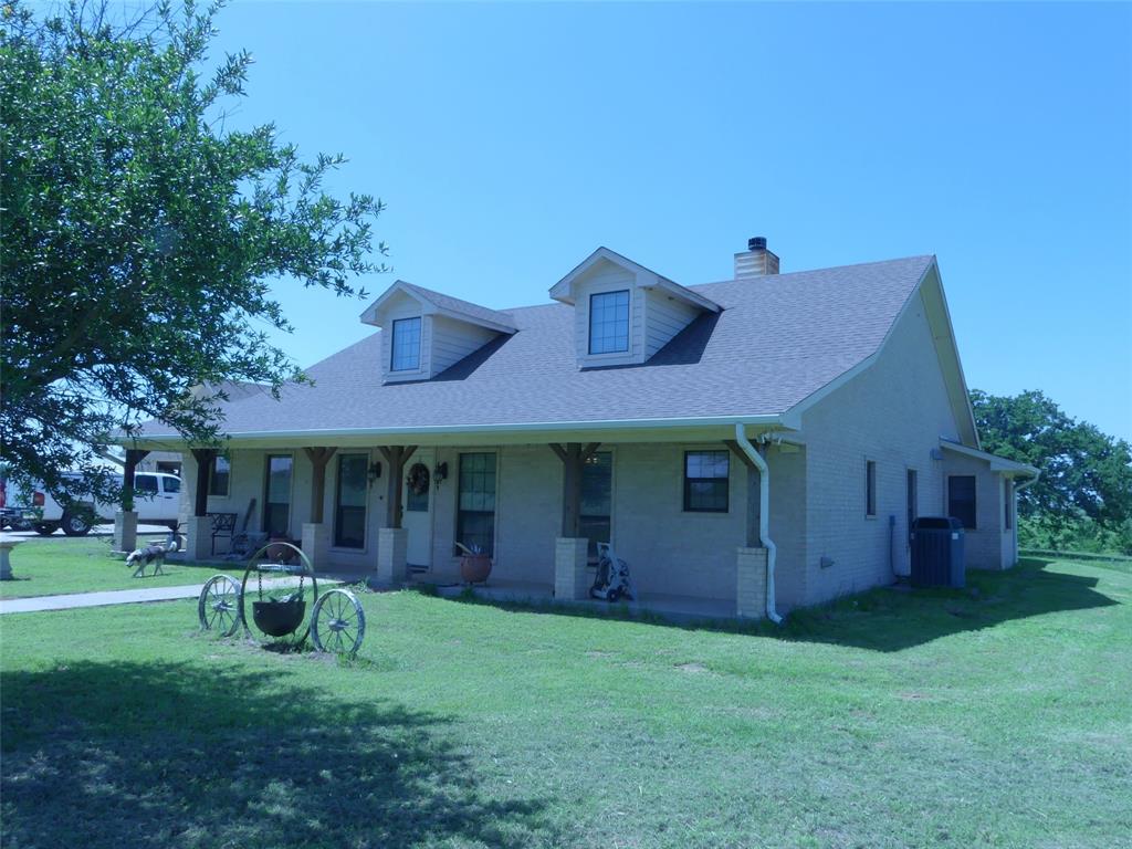 3421 Schoolhouse Road Forestburg, TX 76239 - Photo 23 of 39 a view of a house with a yard
