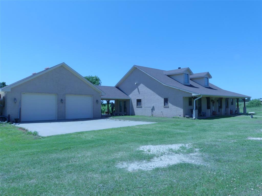 3421 Schoolhouse Road Forestburg, TX 76239 - Photo 3 of 39 a house view with a garden space