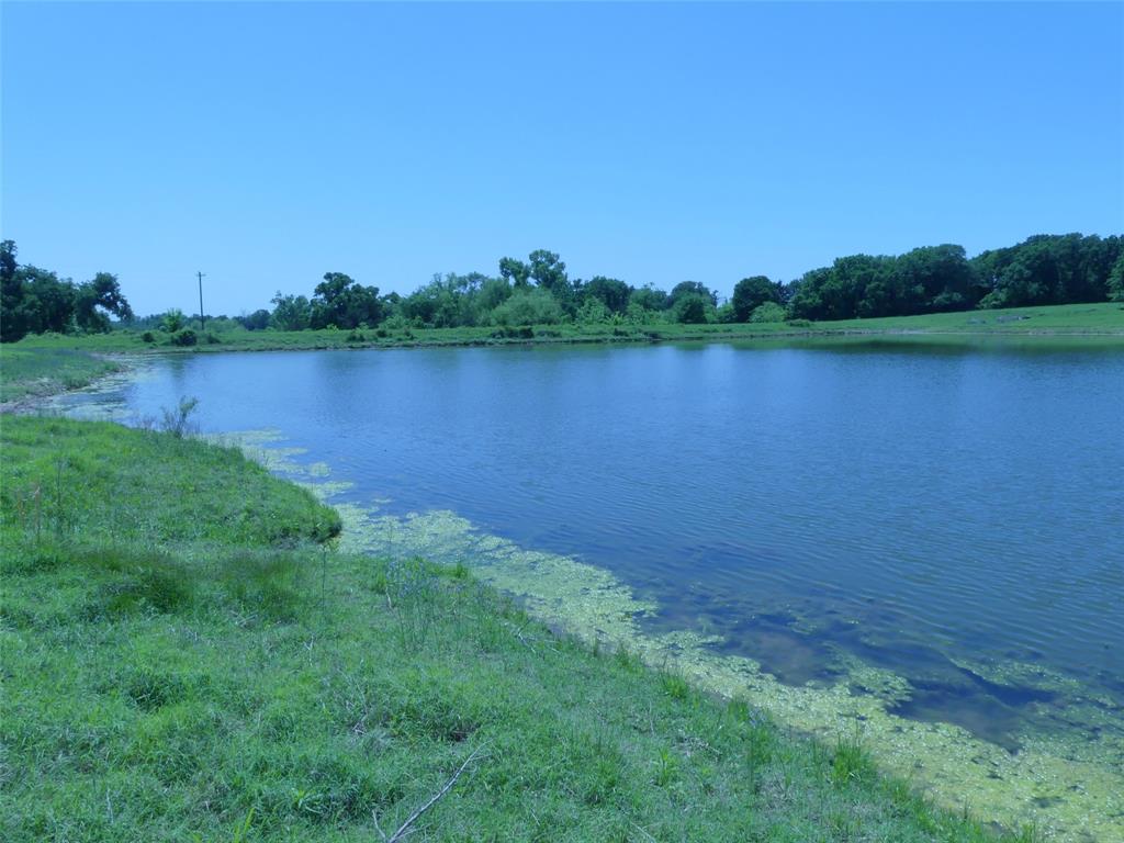 3421 Schoolhouse Road Forestburg, TX 76239 - Photo 31 of 39 a view of a lake with houses in the background