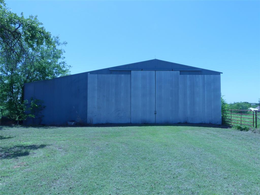 3421 Schoolhouse Road Forestburg, TX 76239 - Photo 38 of 39 a view of backyard with wooden fence