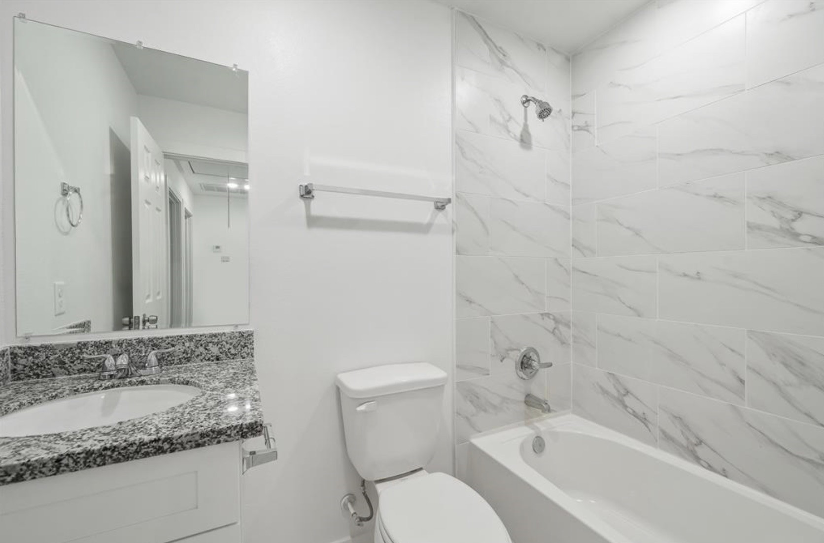 7804 Crestview Drive, Unit B Houston, TX 77028 - Photo 12 of 18 a bathroom with a granite countertop sink toilet and shower