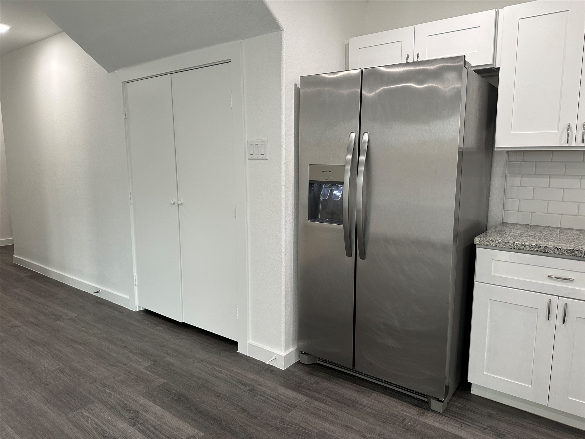 7804 Crestview Drive, Unit B Houston, TX 77028 - Photo 6 of 18 a kitchen with metallic refrigerator freezer and a dishwasher