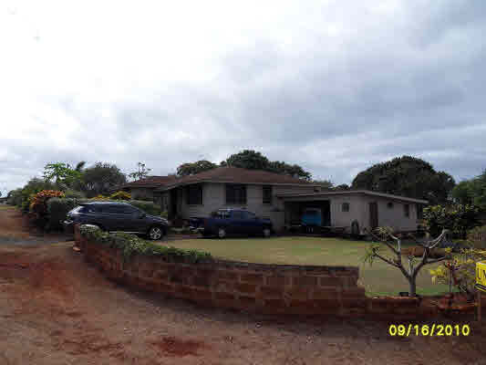 3510 Eleu Road Hanapepe, HI 96716 - Photo 1 of 10 a view of a house with a big yard and large trees