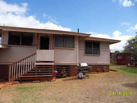 3510 Eleu Road Hanapepe, HI 96716 - Photo 3 of 10 a view of a house with a backyard and porch