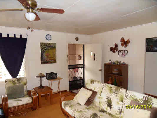 3510 Eleu Road Hanapepe, HI 96716 - Photo 7 of 10 a bedroom with a bed and furniture