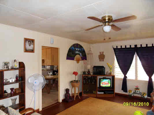 3510 Eleu Road Hanapepe, HI 96716 - Photo 8 of 10 a living room with furniture a flat screen tv and a window