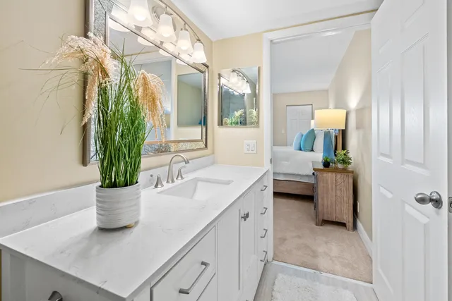 a kitchen with a sink and a mirror