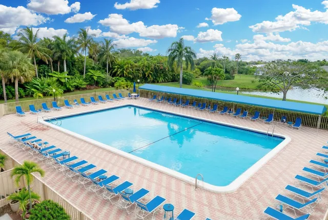 a view of mini swimming pool a yard and outdoor seating