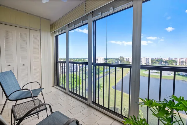 a view of a balcony with furniture