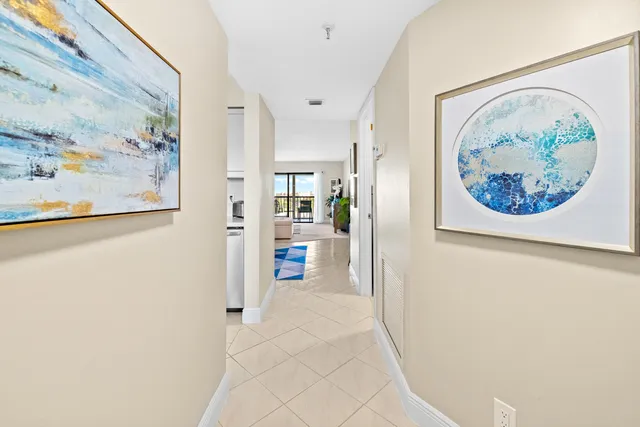 a view of a hallway with a painting on the wall